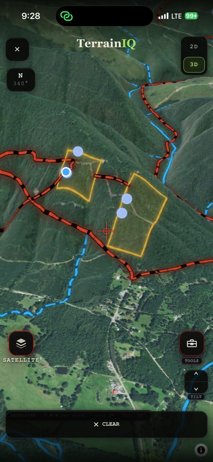TerrainIQ in 3D over satellite, with property lines, two marked areas and creeks on the hillsides